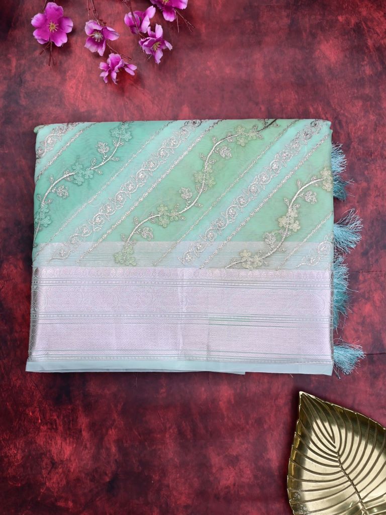 Organza fancy saree light blue color allover embroidery & zari border with short zari pallu and attached plain blouse