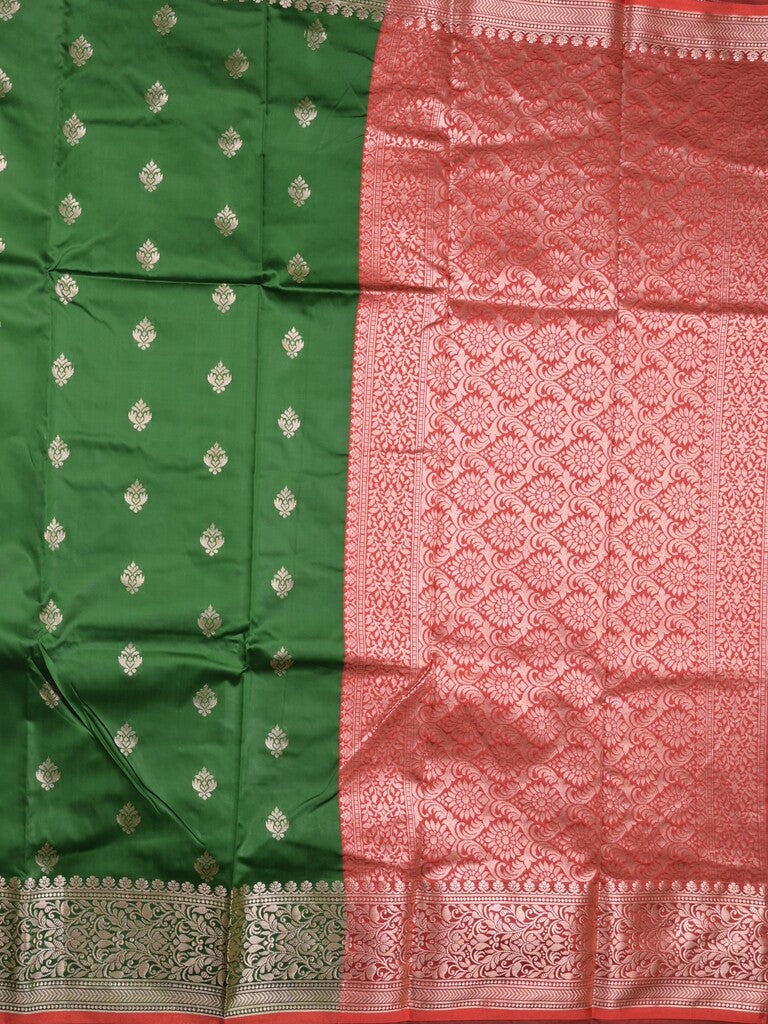 Banaras fancy saree bottle green color allover zari motifs & zari border with rich pallu and contrast plain blouse