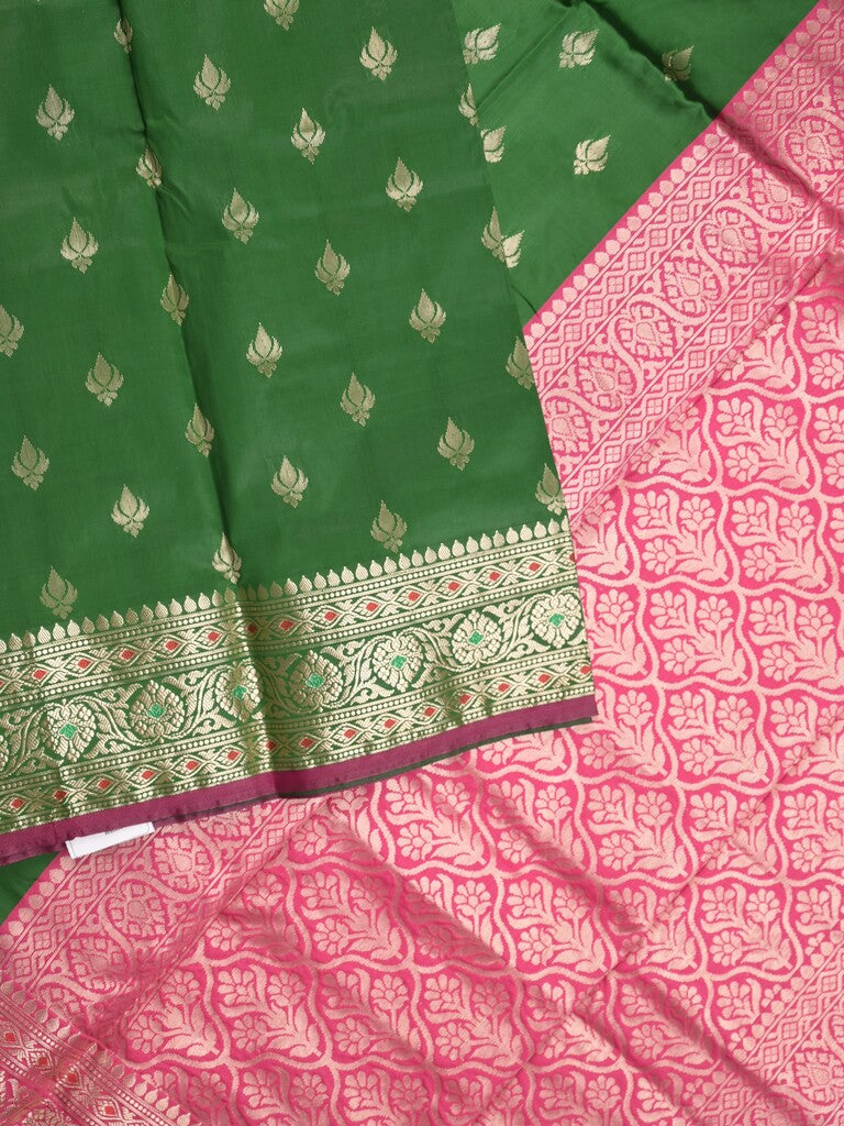 Banaras fancy saree bottle green color allover zari motifs & zari border with rich pallu and contrast plain blouse