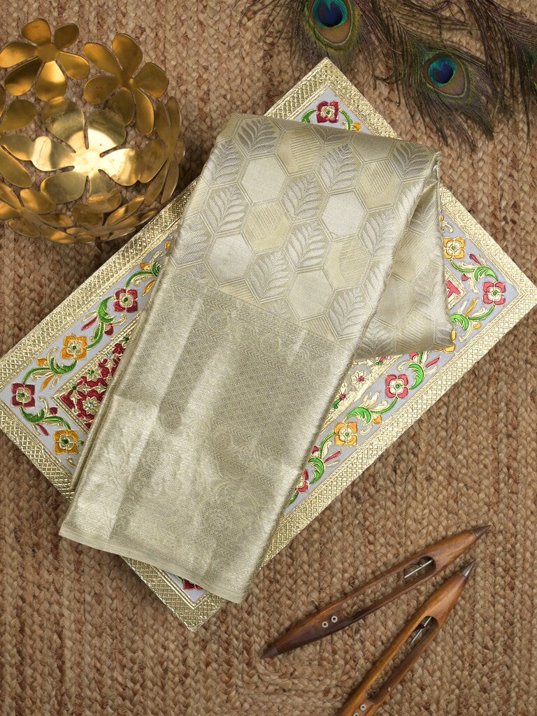 Kanchi tissue pattu bridal saree cream color allover zari weaves & kanchi border with rich pallu and attached plain blouse