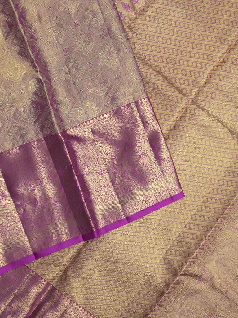 Kanchi tissue pattu saree light purple color allover zari weaves & kanchi border with rich pallu and attached plain blouse