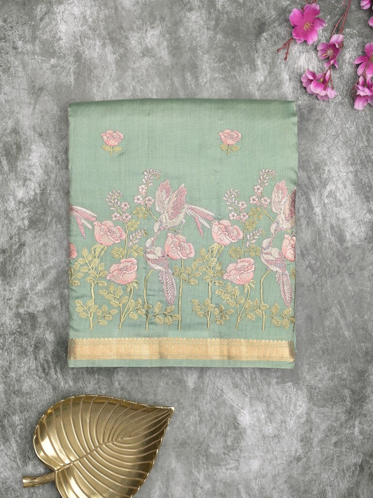 Munga pattu saree pista green color allover embroidery butis & small zari border with short pallu and attached plain blouse