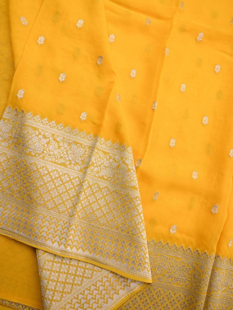 Georgette fancy saree lemon yellow color allover zari motifs & big zari border with rich pallu and attached plain blouse