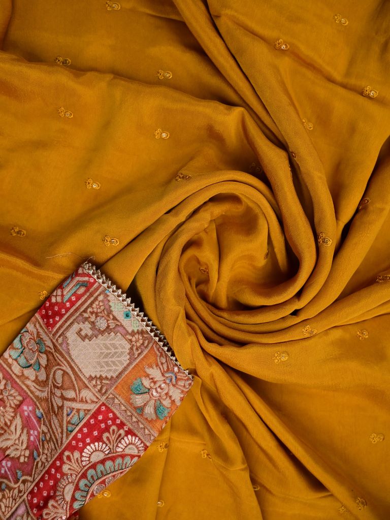 Chinnon fancy saree golden yellow color allover embroidery & fancy border with running pallu and stitched blouse