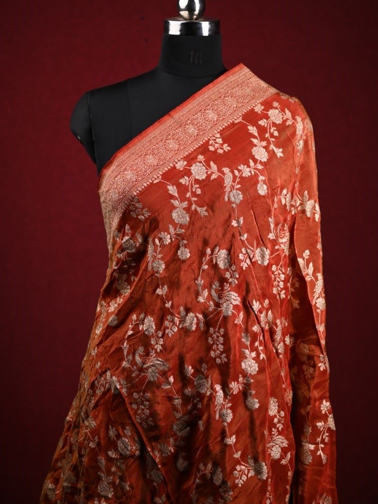 Dola tissue dupatta dark orange color with allover zari weaving with small zari border