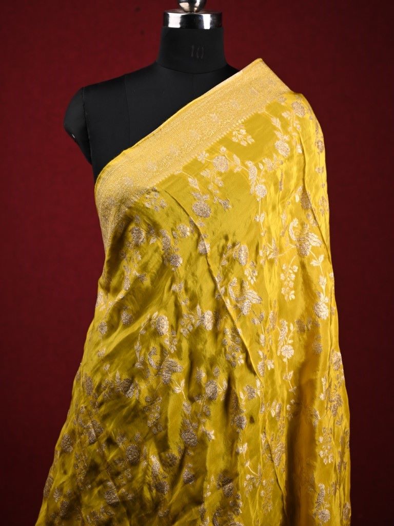 Dola tissue dupatta lemon yellow color with allover zari weaving with small zari border