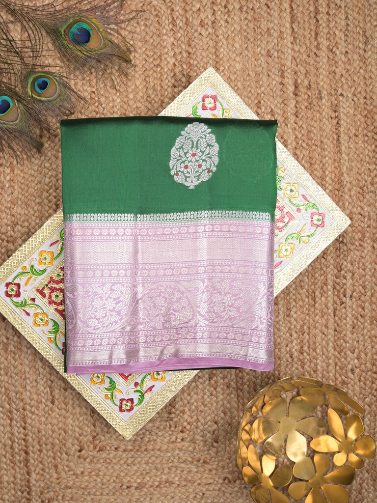 Raw mango pattu saree bottle green color allover zari weaves & zari border with brocade pallu and contrast blouse