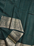 Dupion fancy saree dark green color allover zari stripes & zari weaving border with rich pallu and brocade blouse