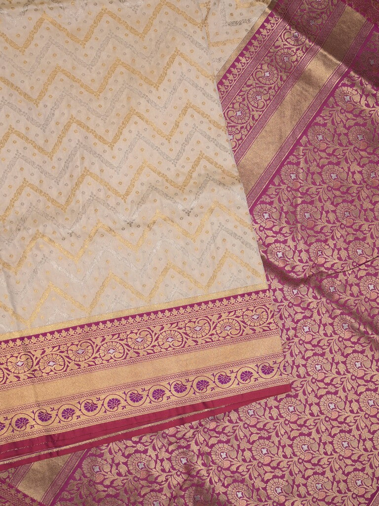 Banaras fancy saree half white color allover zari motifs & zari border with pallu and contrast plain blouse