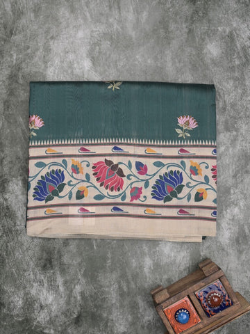 Tussar fancy saree dark green color allover prints & printed border with contrast pallu and printed blouse