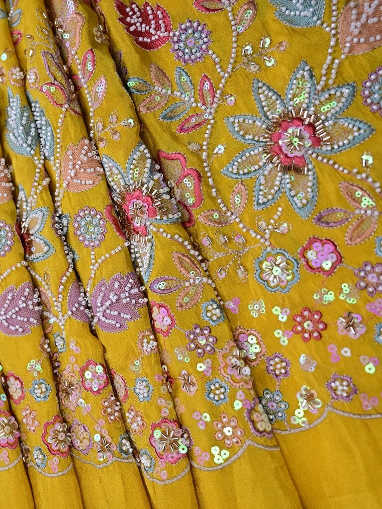 Golden yellow color dola silk fabric with allover embroidery work