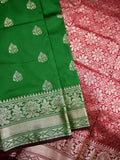 Banaras fancy saree bottle green color allover zari motifs & zari border with rich pallu and contrast plain blouse