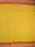 Jute kadhi cotton golden yellow color allover checks & contrast border with contrast pallu and running blouse