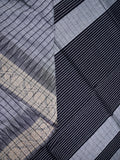 Jute kadhi cotton grey color allover checks & contrast border with contrast pallu and running blouse