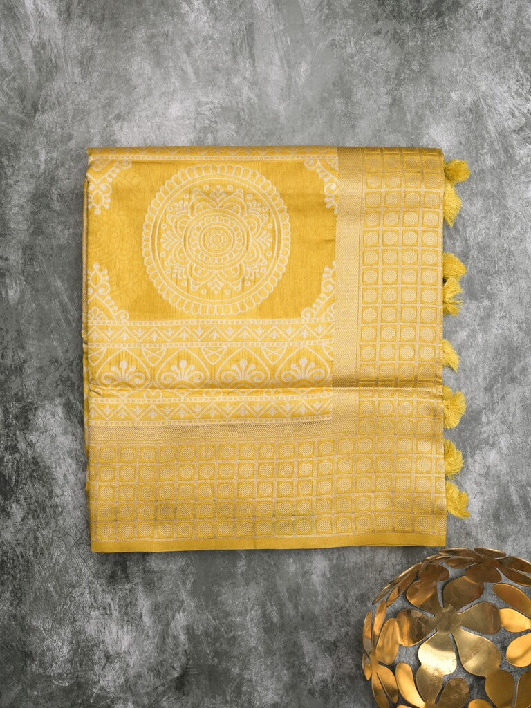 Dupion fancy saree golden yellow color allover prints & zari border with rich pallu and attached plain blouse