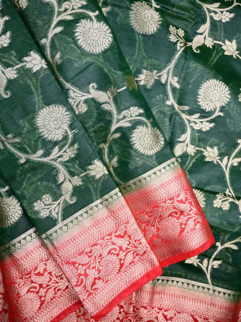 Banaras fancy saree bottle green color allover zari weaving & zari border with rich pallu and plain contrast blouse