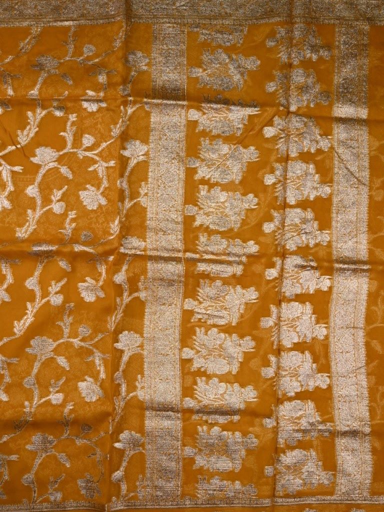 Kora georgette fancy saree mustard yellow color with allover zari stripes & motifs with zari border with rich pallu and designer blouse