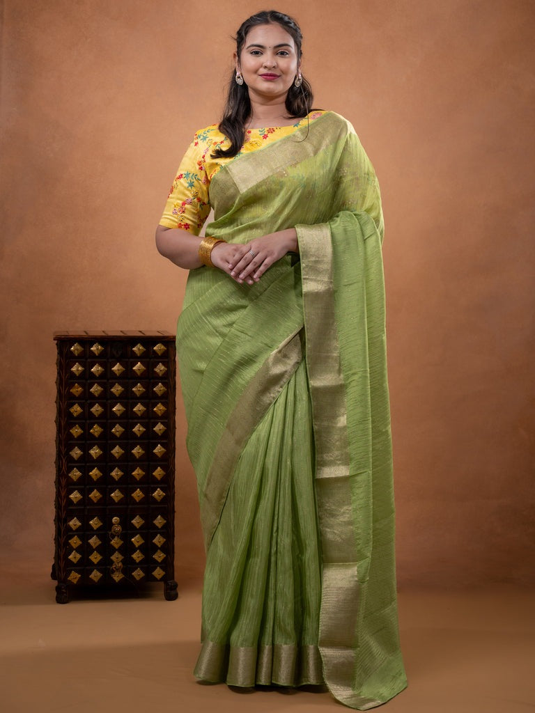 Organza fancy saree parrot green color allover weaves & zari border with short pallu and plain contrast blouse