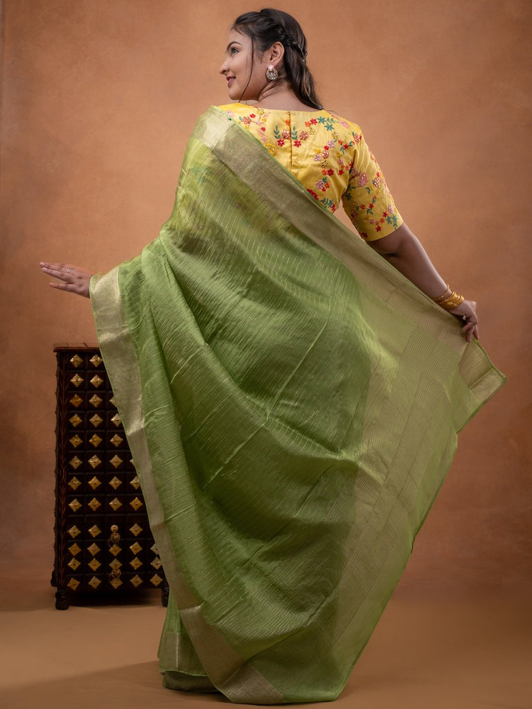 Organza fancy saree parrot green color allover weaves & zari border with short pallu and plain contrast blouse