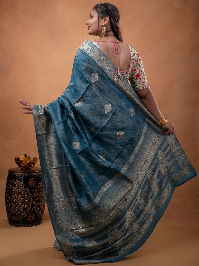 Dola tissue fancy saree light blue color allover zari motifs & zari border with rich pallu and plain self blouse