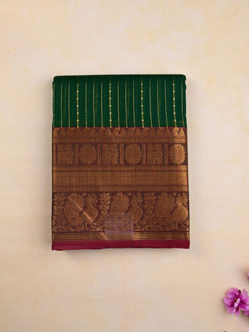 Kanchi cotton saree bottle green color allover zari weaves & kanchi border with rich pallu and plain blouse