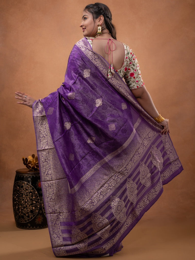 Dola tissue fancy saree purple color allover zari motifs & zari border with rich pallu and plain self blouse