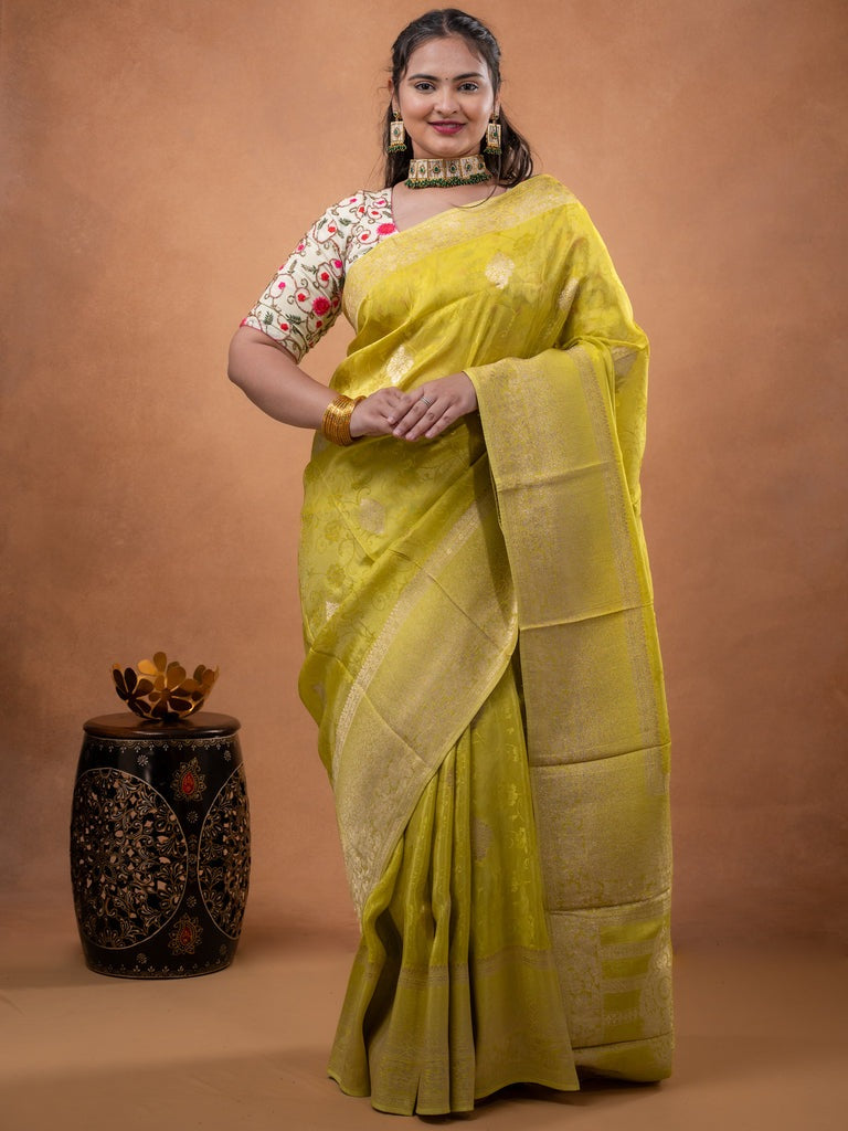 Dola tissue fancy saree lemon yellow color allover zari motifs & zari border with rich pallu and plain self blouse