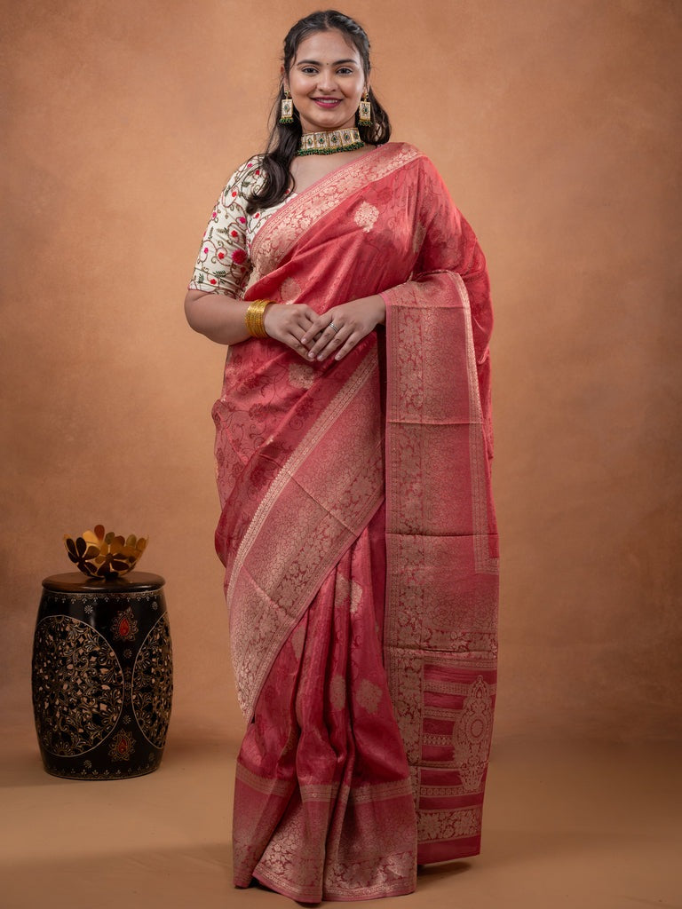 Dola tissue fancy saree coral pink color allover zari motifs & zari border with rich pallu and plain self blouse