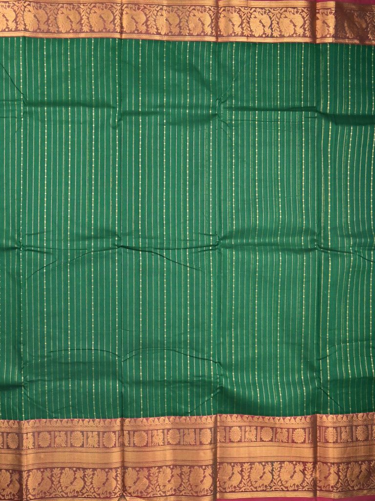 Kanchi cotton saree bottle green color allover zari weaves & kanchi border with rich pallu and plain blouse