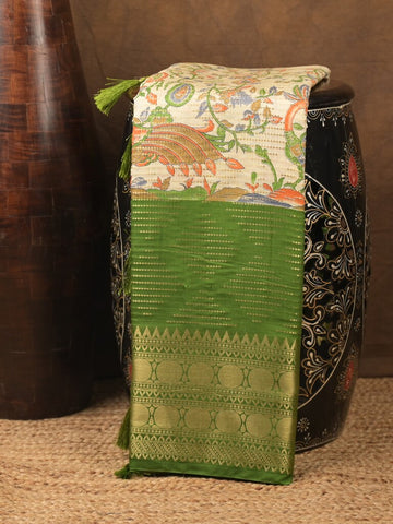 Dola silk fancy saree cream and green color allover prints & zari border with contrast pallu and attached blouse