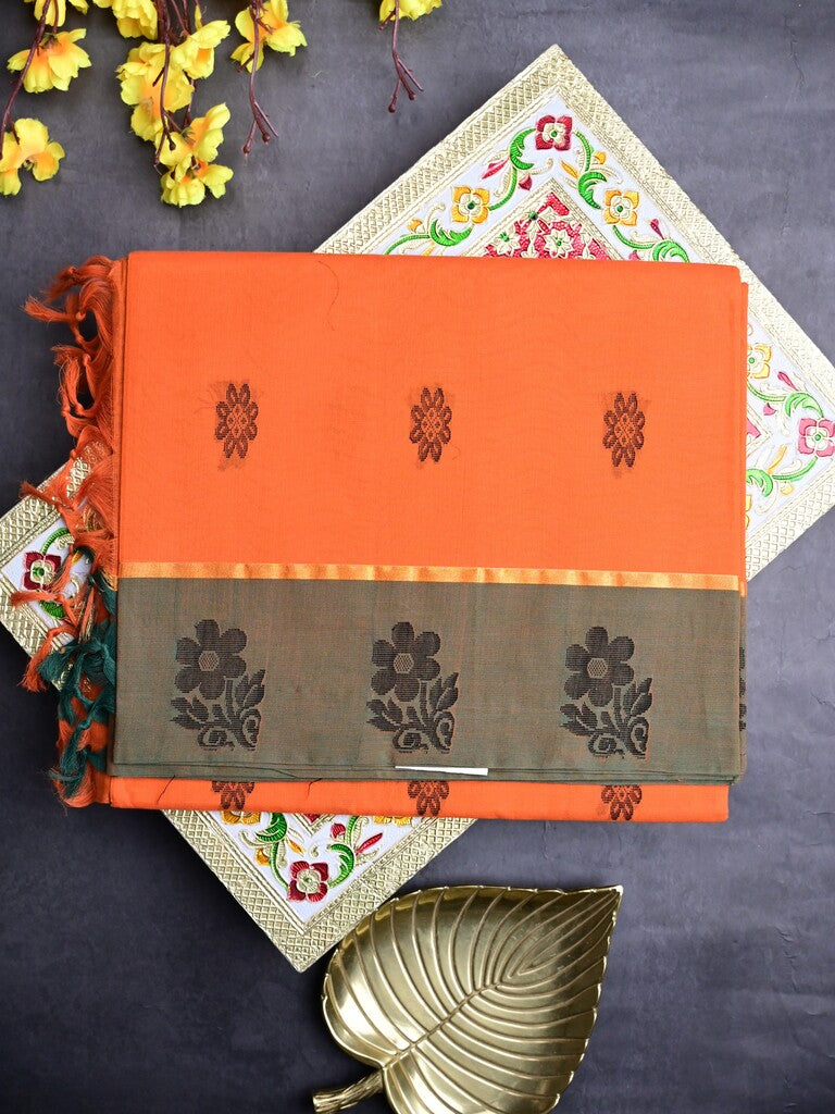 Kanchi cotton saree orange color allover motifs & small border with rich pallu and attached plain blouse