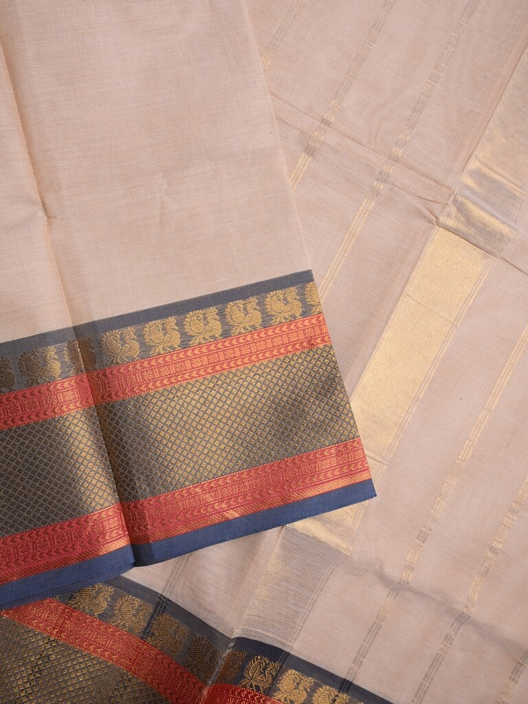 Kanchi cotton saree light peach color allover plain & contrast zari border with stripes pallu and plain self blouse