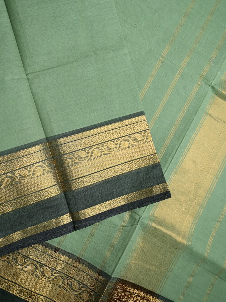 Kanchi cotton saree light pista green color allover plain & contrast zari border with stripes pallu and plain self blouse