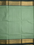 Kanchi cotton saree light pista green color allover plain & contrast zari border with stripes pallu and plain self blouse