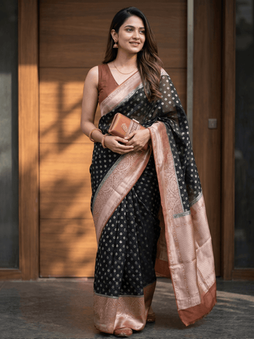 Georgette fancy saree black color allover zari motifs & zari border with rich pallu and attached plain blouse