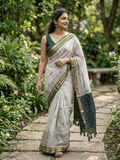 Maheshwari fancy saree in white color with allover prints & zari border with short pallu and contrast blouse