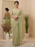 Organza fancy saree light pastel green color allover embroidered motifs & cutwork border with running pallu and self blouse