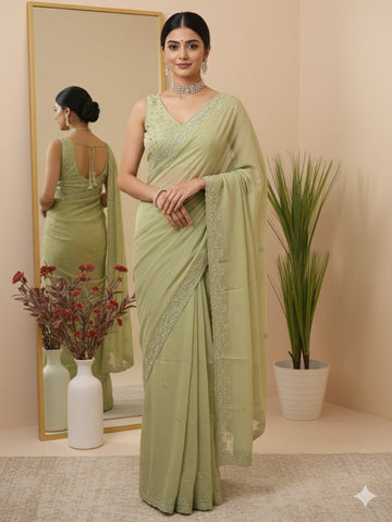 Organza fancy saree light pastel green color allover embroidered motifs & cutwork border with running pallu and self blouse