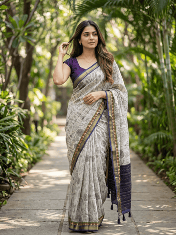 Maheshwari fancy saree in white color with allover prints & zari border with short pallu and contrast blouse