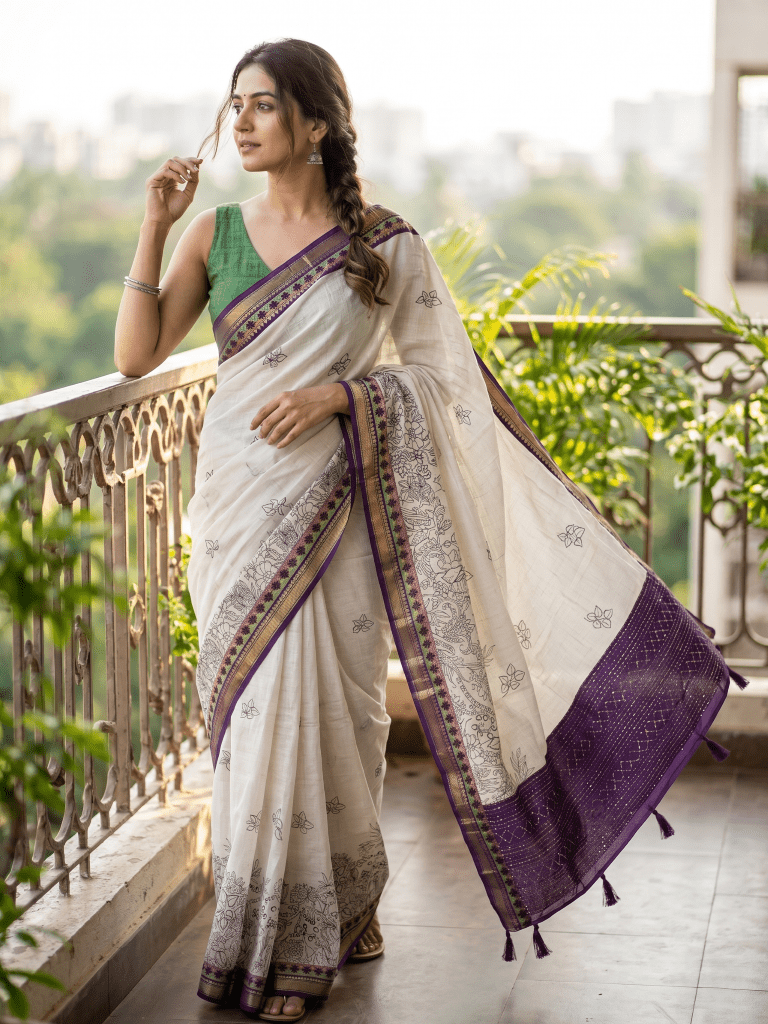 Maheshwari fancy saree in white color with allover prints & zari border with short pallu and contrast blouse
