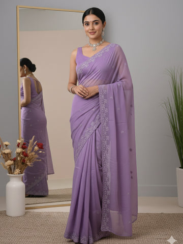 Organza fancy saree lavender color allover embroidered motifs & cutwork border with running pallu and self blouse