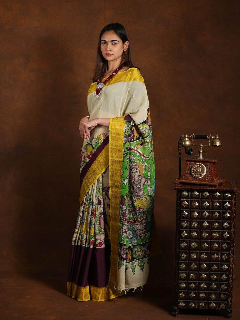 Pen kalamkari pattu saree in cream color with contrast zari border and printed pallu & attached blouse