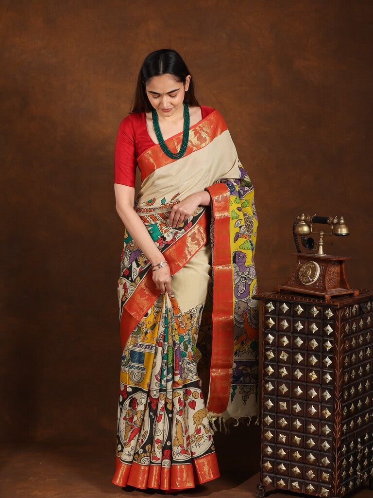 Pen kalamkari pattu saree in cream color with contrast zari border and printed pallu & attached blouse