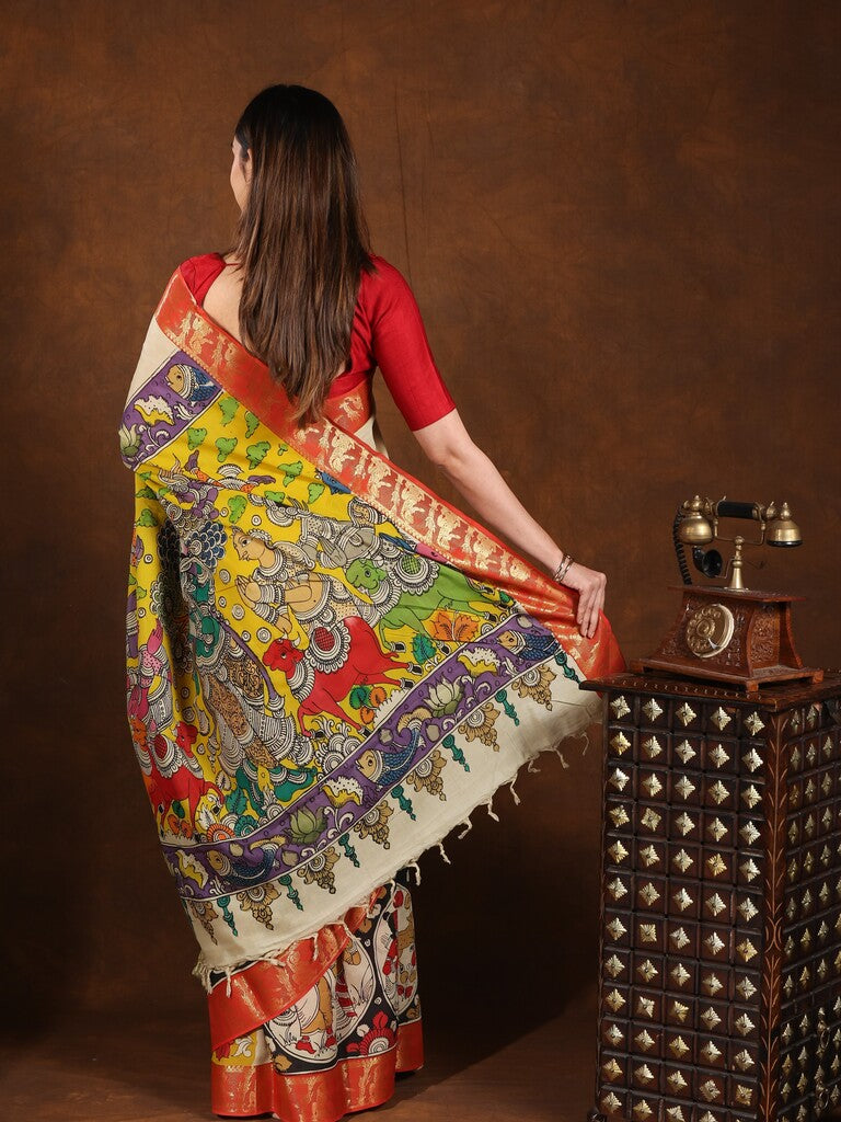 Pen kalamkari pattu saree in cream color with contrast zari border and printed pallu & attached blouse