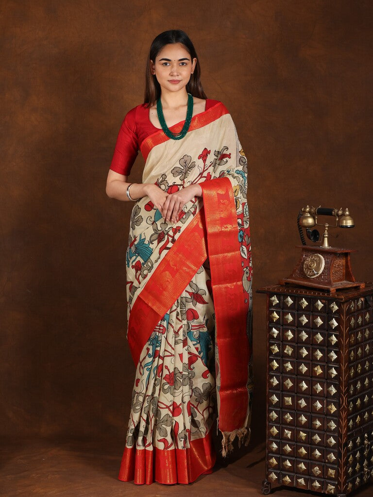 Pen kalamkari pattu saree in cream color with contrast zari border and printed pallu & attached blouse