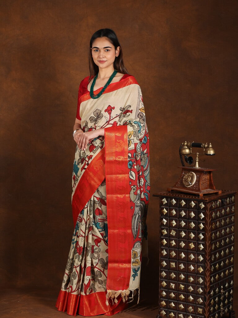 Pen kalamkari pattu saree in cream color with contrast zari border and printed pallu & attached blouse