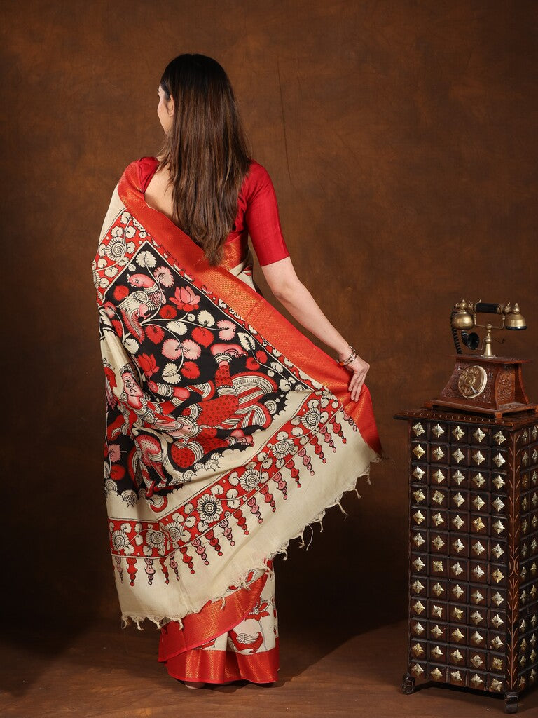 Pen kalamkari pattu saree in cream color with contrast zari border and printed pallu & attached blouse