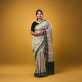 Maheswari fancy saree white color allover prints & zari border with short pallu and plain contrast blouse