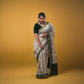 Maheswari fancy saree white color allover prints & zari border with short pallu and plain contrast blouse