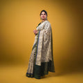 Maheswari fancy saree white color allover prints & zari border with short pallu and plain contrast blouse